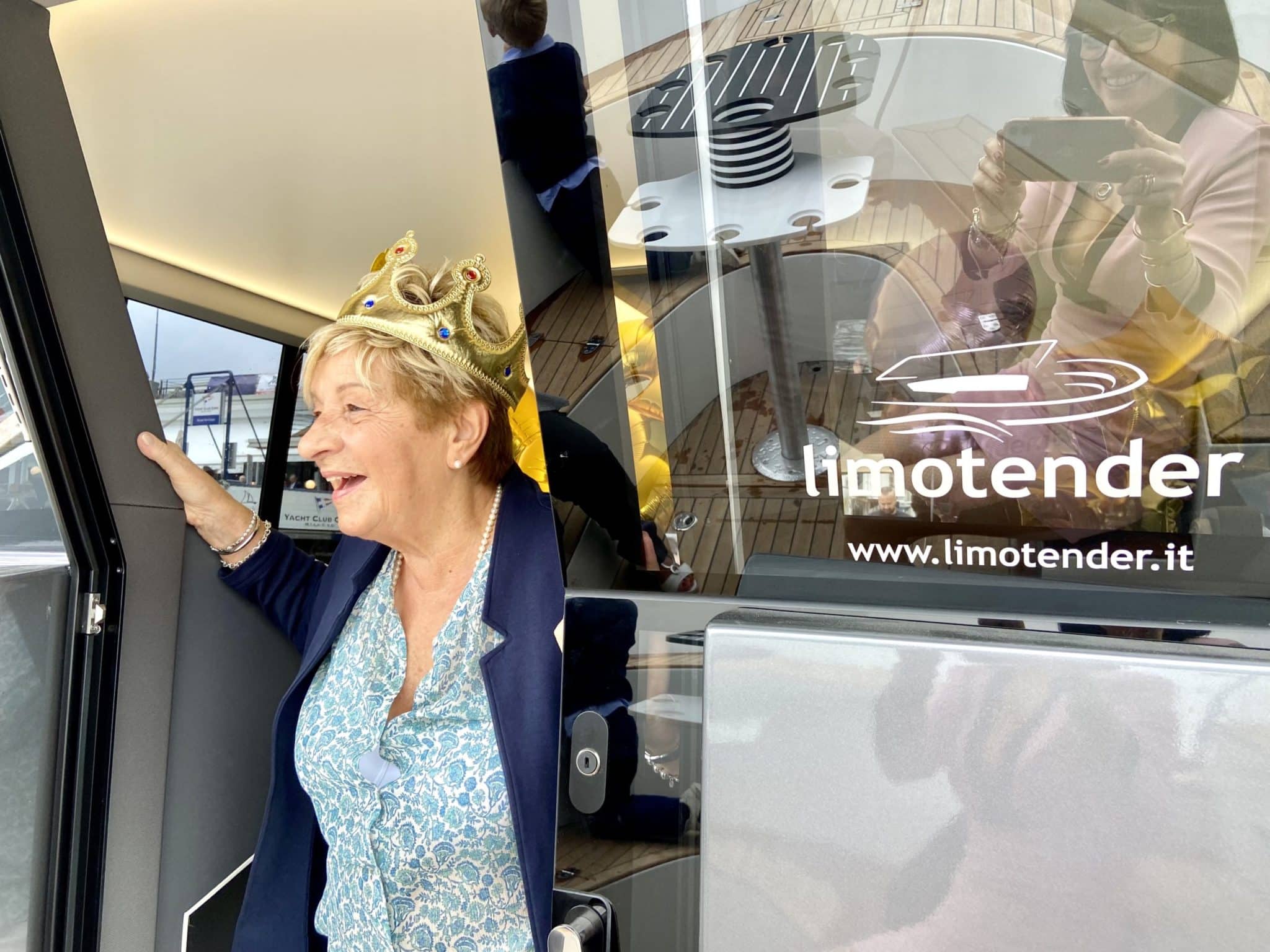 Woman exits private boat lake como after her private cruise rent to celabrate an anniversary at lake como